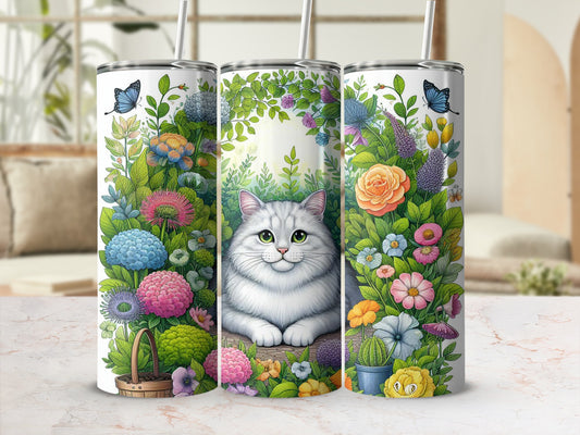 White cat sits amidst a floral arrangement with butterflies.