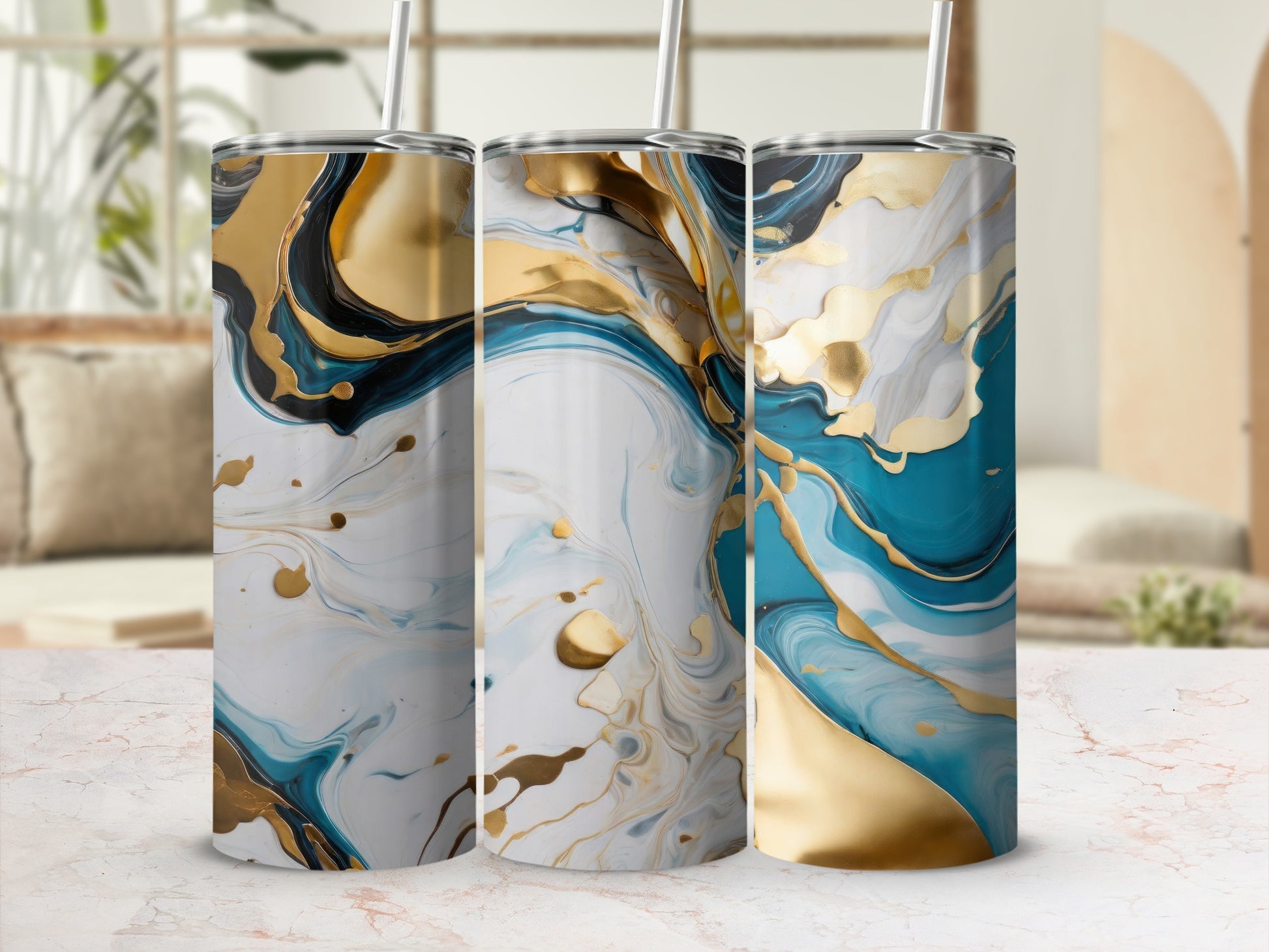 Three tumblers with abstract gold and teal marbled designs and straws.