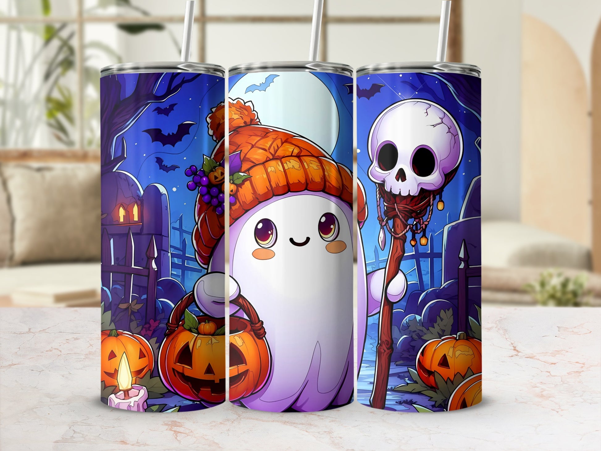 Three tumblers with a cute ghost and Halloween scene featuring pumpkins and bats.