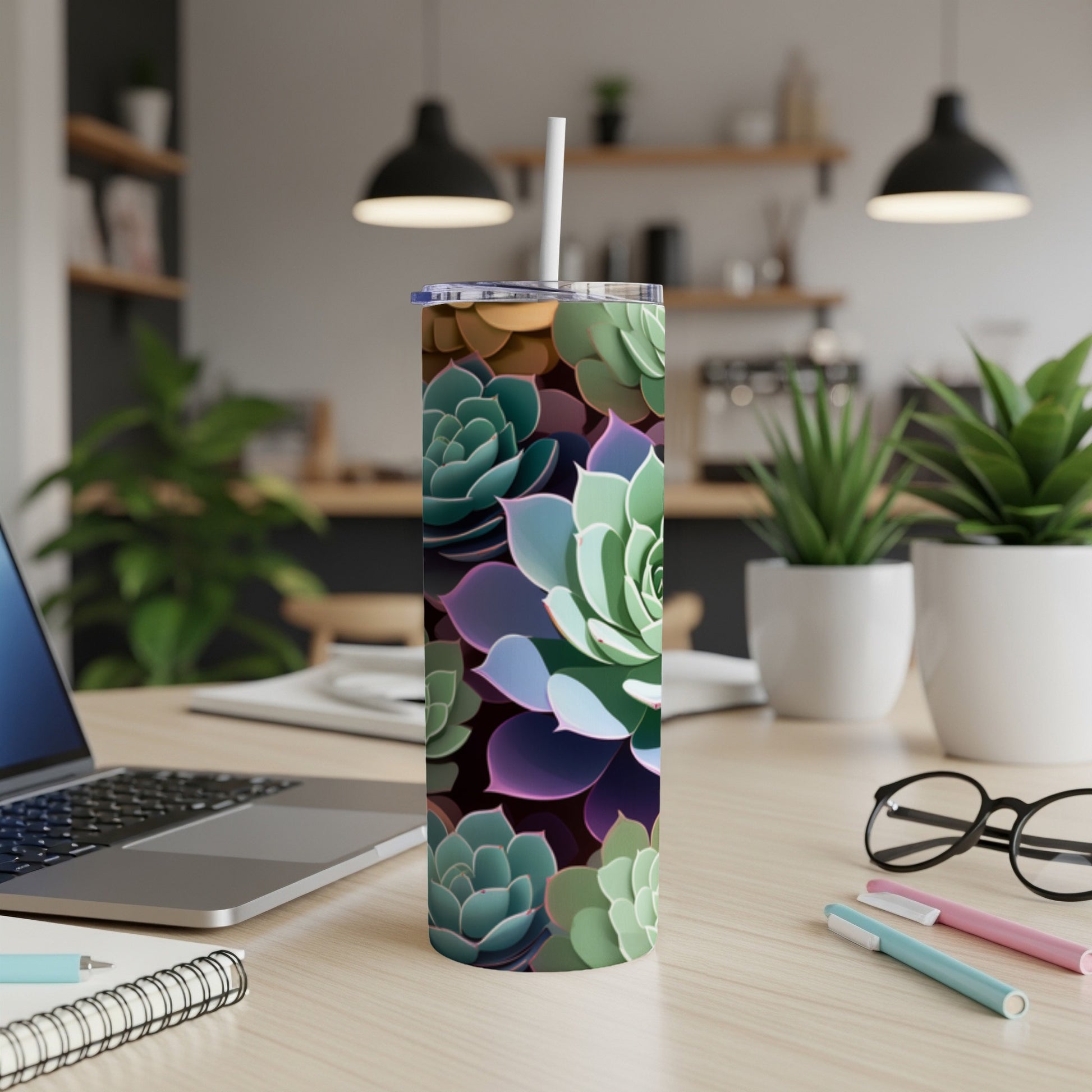 Succulent pattern on a tall, insulated tumbler with a straw.
