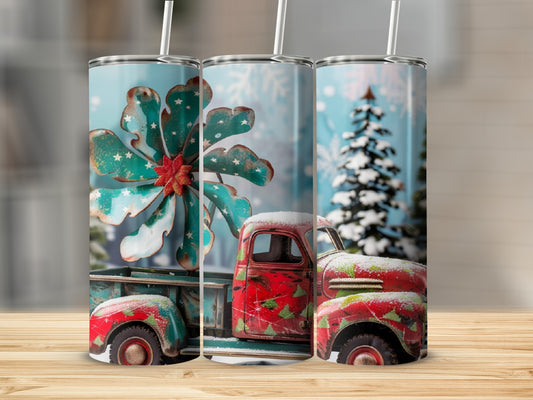 Christmas truck with snowflake wheel, snow-covered trees, and snowflakes.