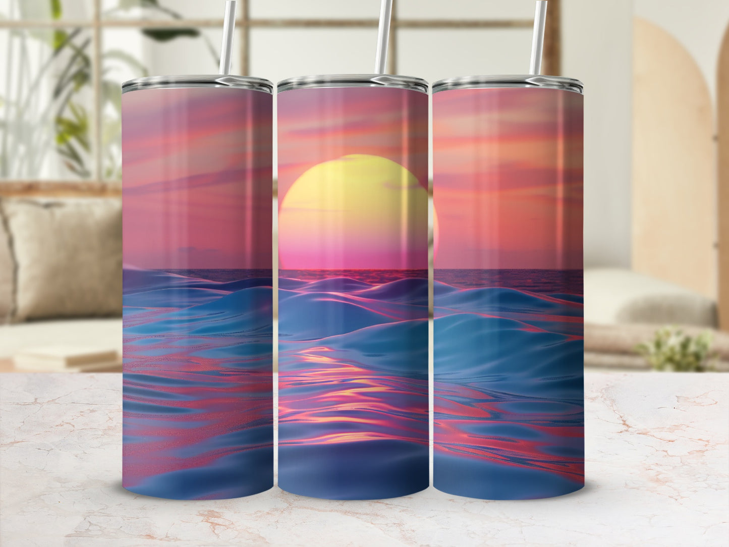 Three tumblers with a sunset ocean wave design.