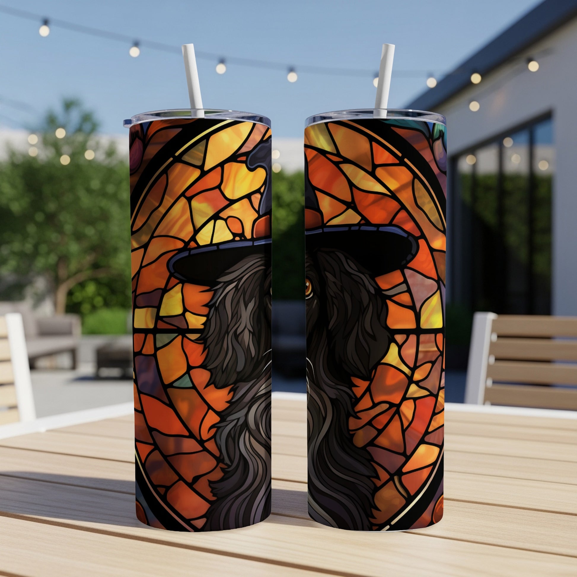 Two tumblers featuring a black wolf in stained glass style with orange and yellow hues.