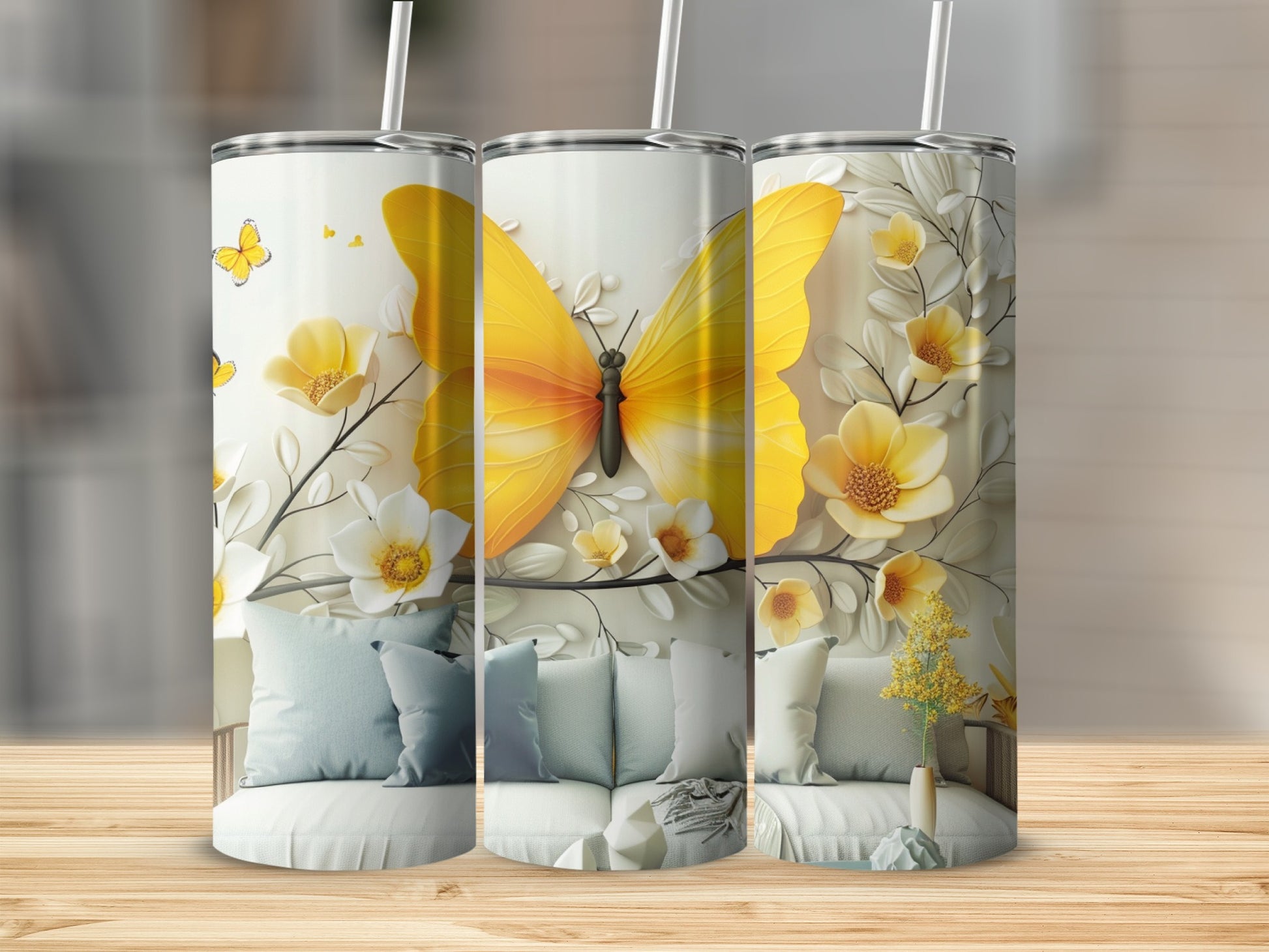 Three tumblers with yellow butterflies and floral designs.