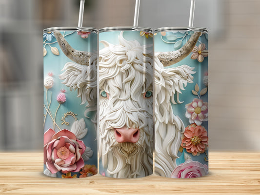 White Highland cow face on a floral patterned tumbler with pink nose.