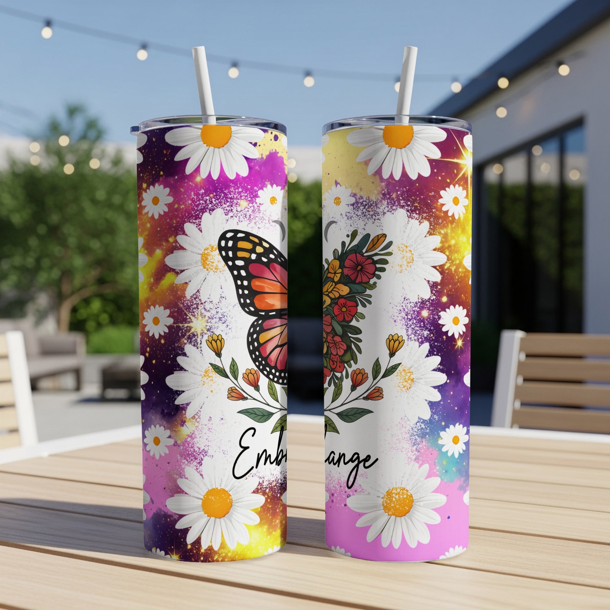 Tumbler with butterfly and flowers, text "Embrace".