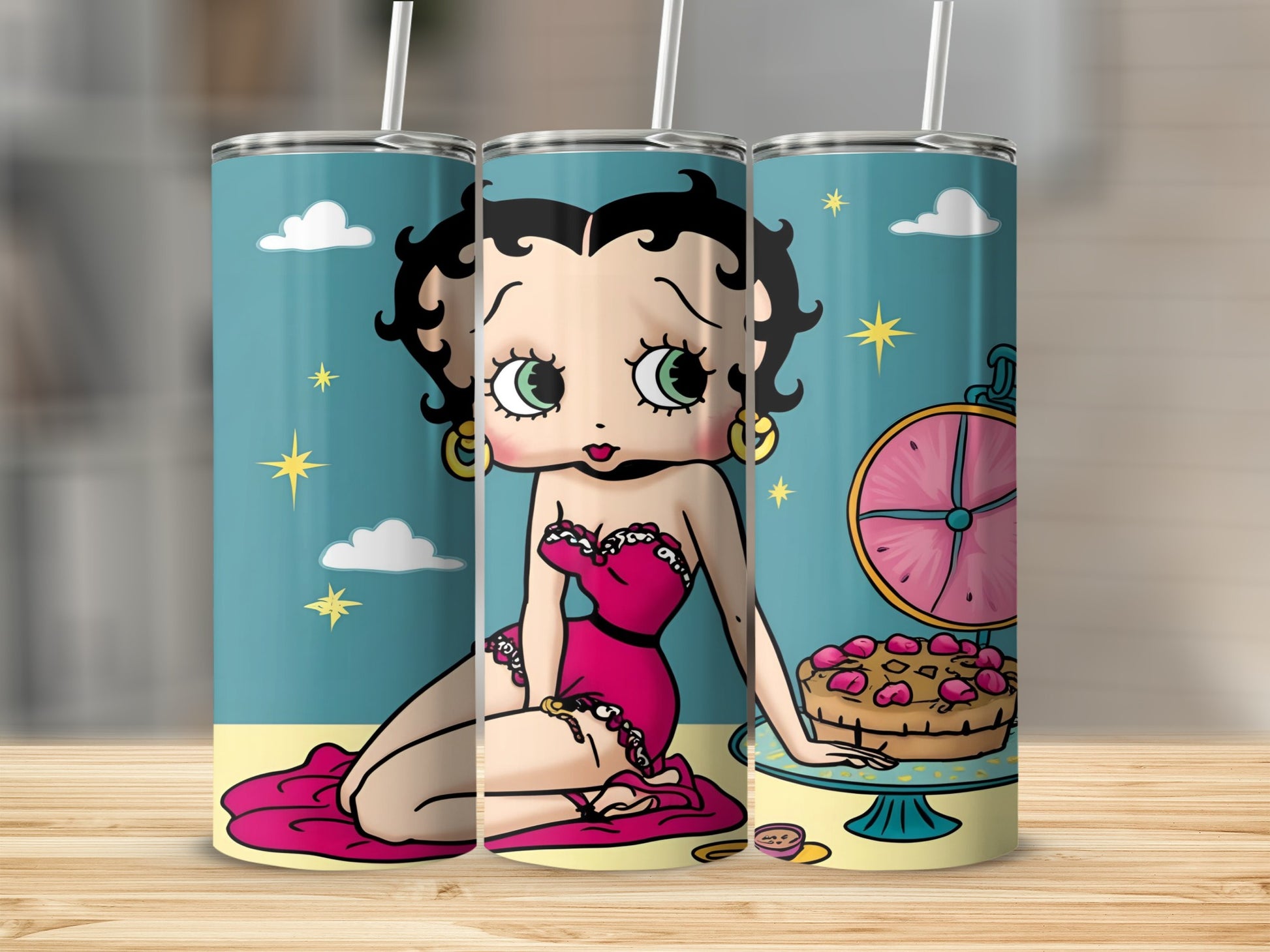 Betty Boop character in pink dress sitting next to a cake.