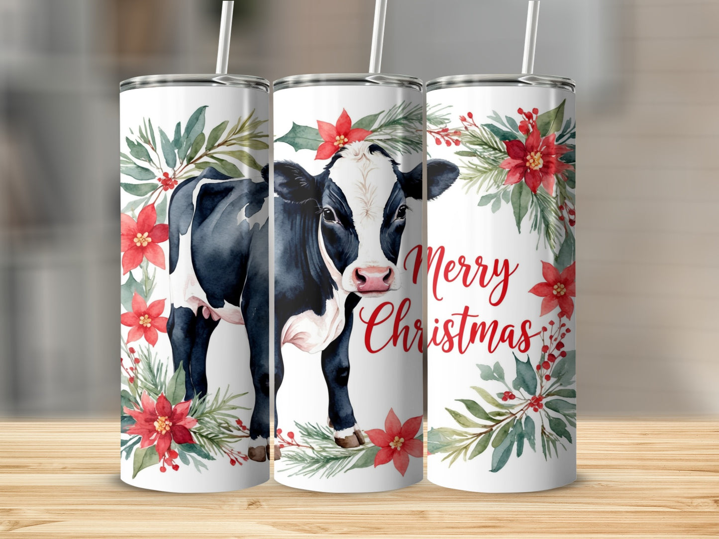 Black and white cow with poinsettias and "Merry Christmas" text on tumbler.