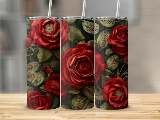 Three tumblers with deep red roses and green leaves.