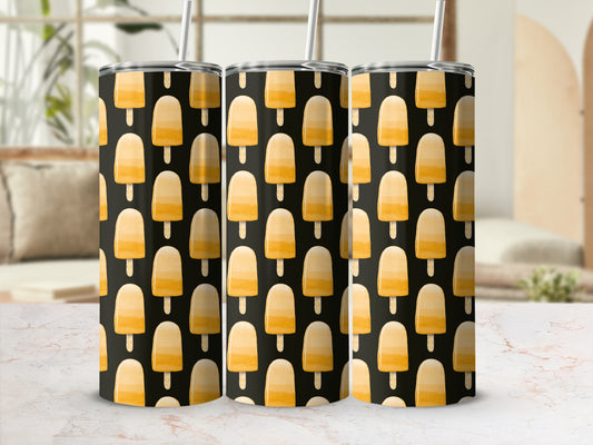Three tumblers with a pattern of orange popsicle ice cream on a black background.