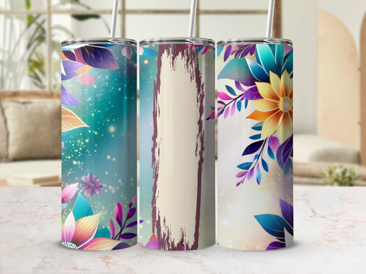 Three tall tumblers with floral designs and straw, displayed on a marble surface.