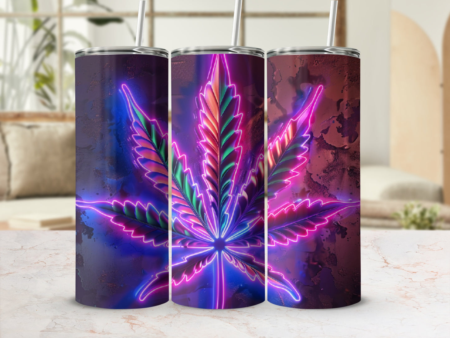 Cannabis leaf design on three travel tumblers with neon accents.