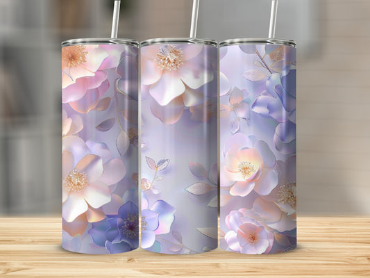Three tumblers with iridescent floral designs in pastel colors.