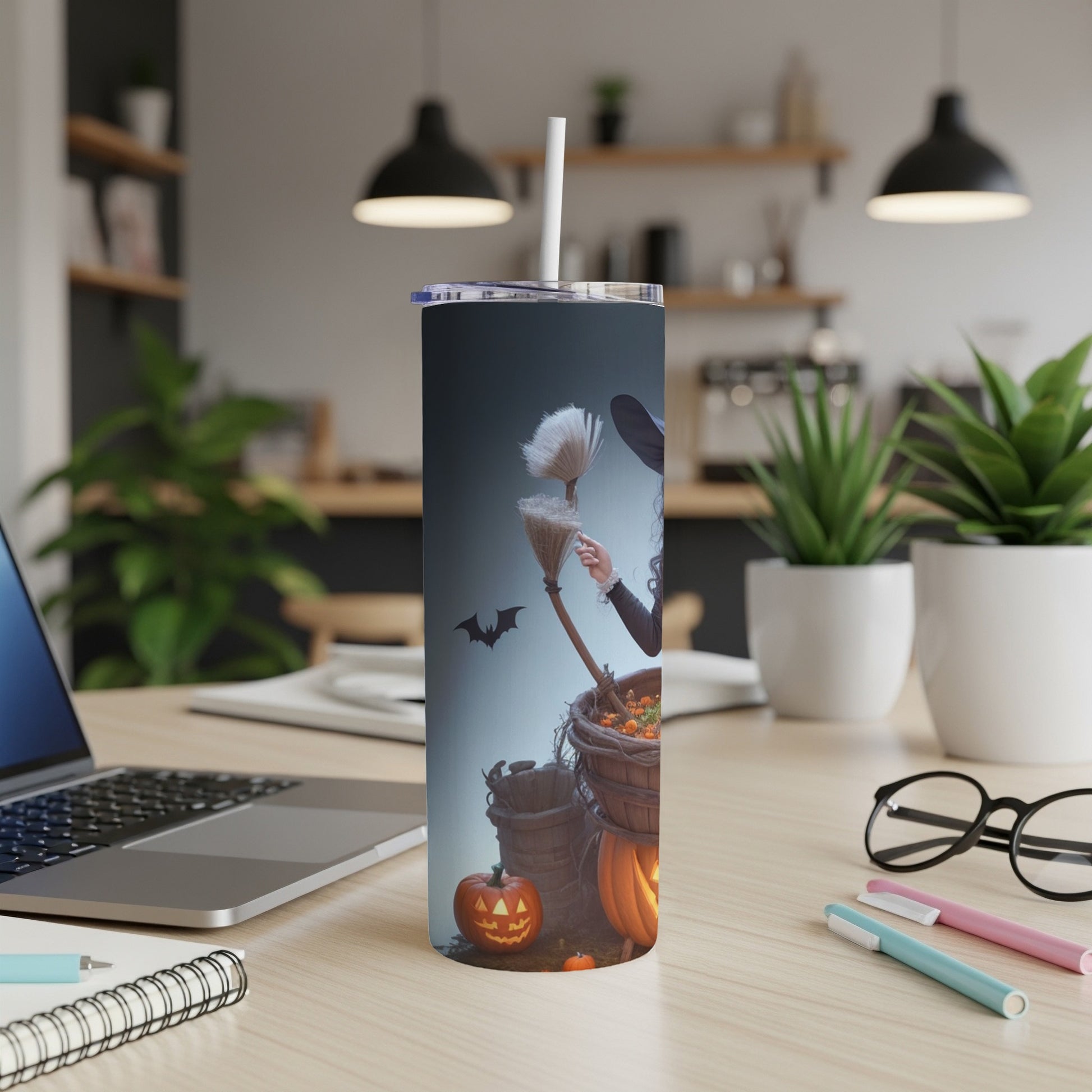Tumbler with witch, broom, pumpkins, and bat Halloween design.