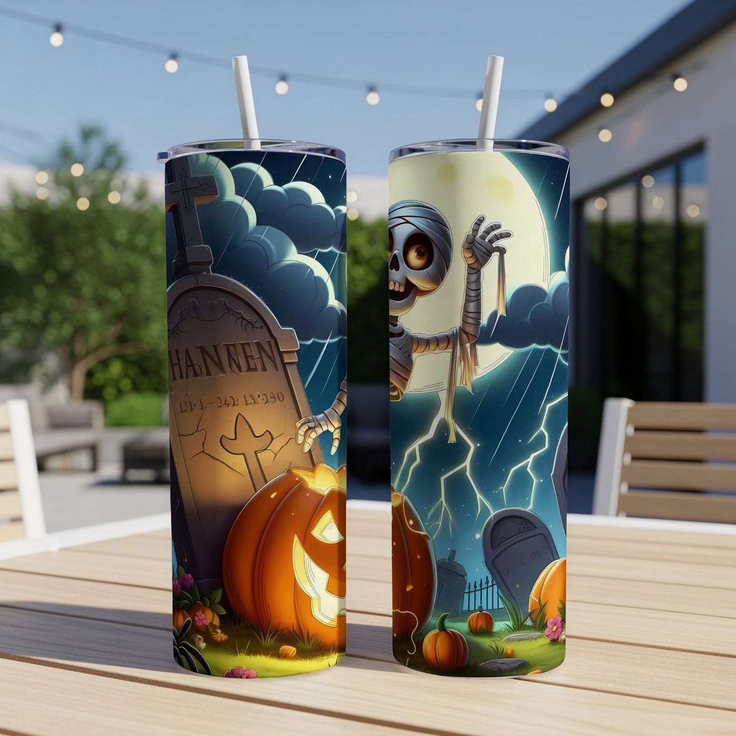 Halloween tumblers with graveyard, mummy, and pumpkin designs.