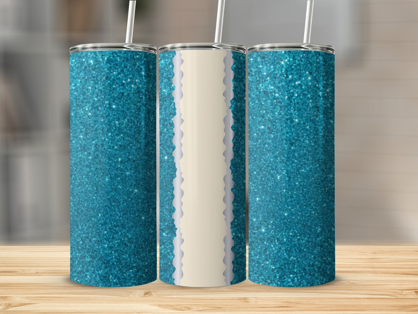 Three teal glitter tumblers with straw on a wooden surface.