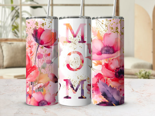 Floral tumbler with "MOM" text and gold glitter accents.