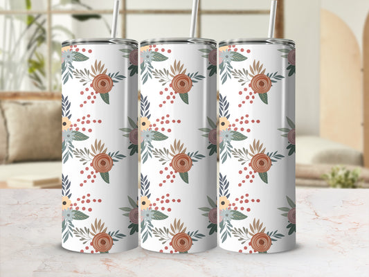 Three tumblers with a floral pattern of red, blue, and green on a white background.