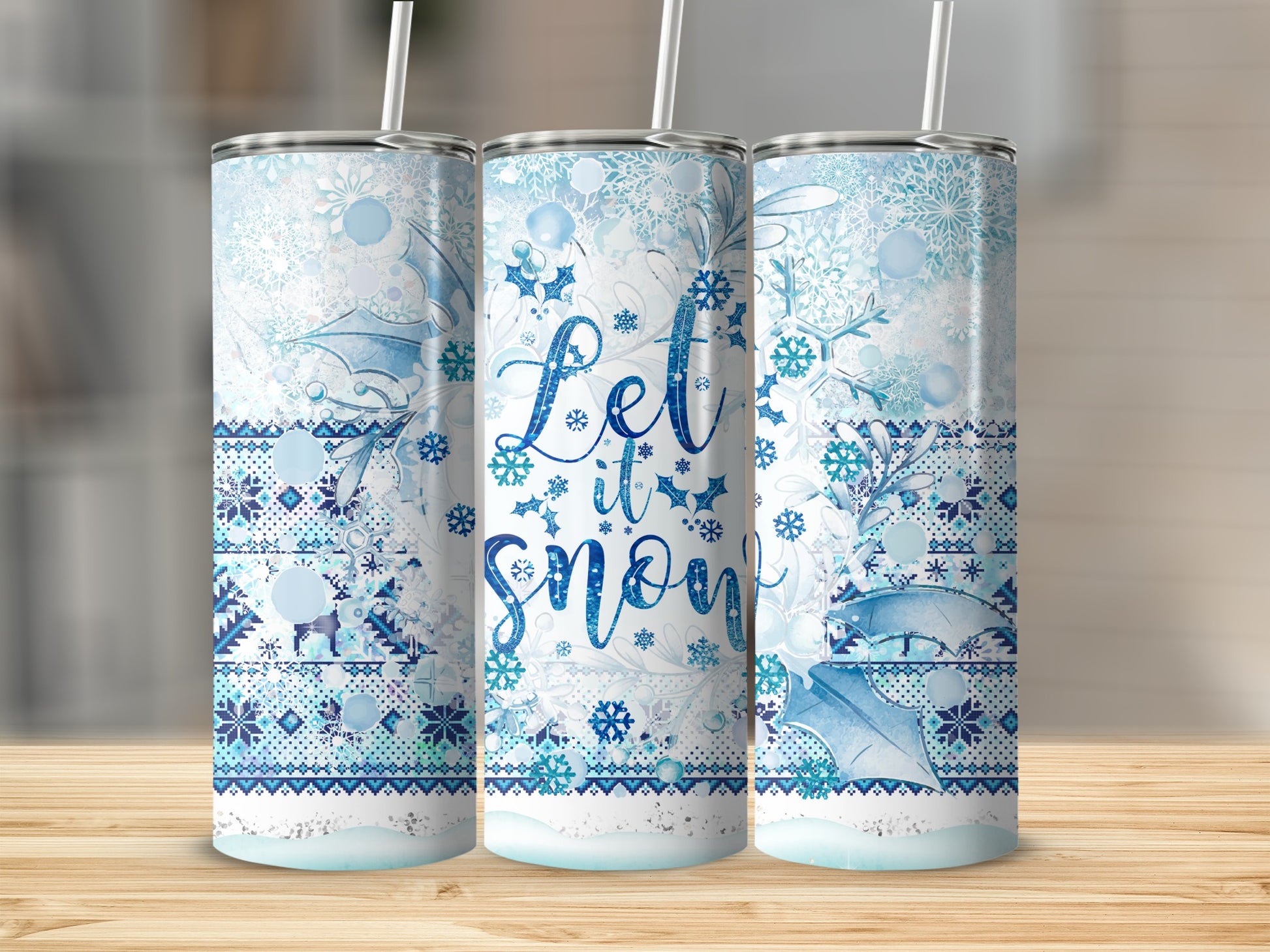 Blue and white snowflake patterned tumbler with "Let it snow" text.