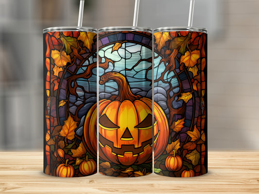 Halloween pumpkin tumbler with stained glass and autumn leaves.