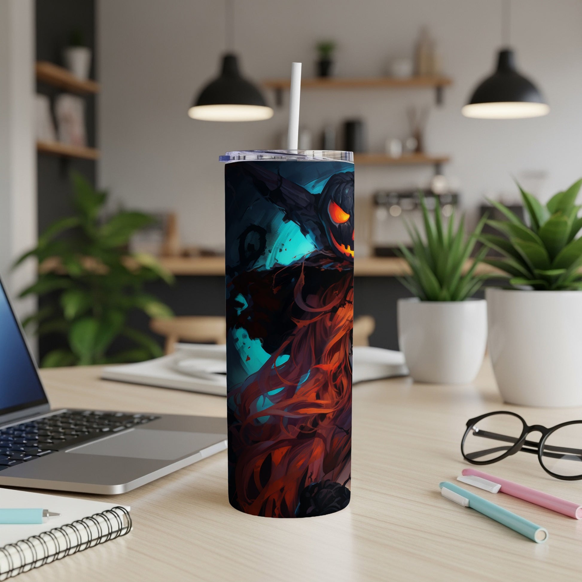 Tumbler with a glowing jack-o'-lantern and flowing flames design.