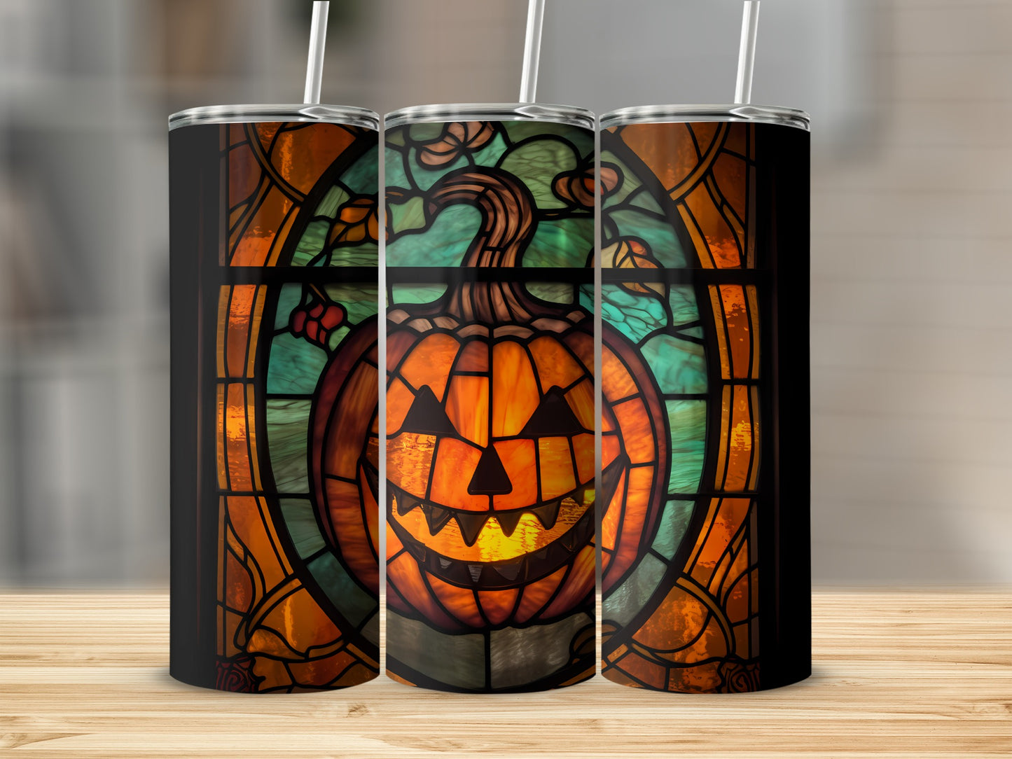 Three tumblers with a stained-glass Halloween pumpkin design.