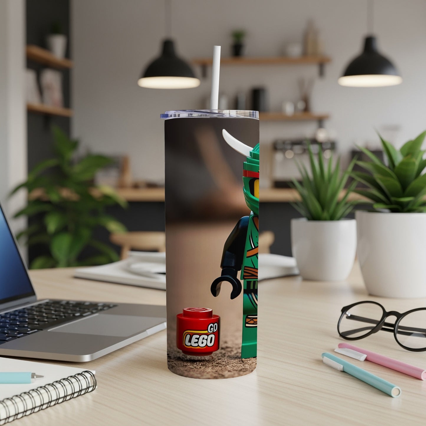 Green Lego ninja figure and "Go Lego" brick on a tumbler.