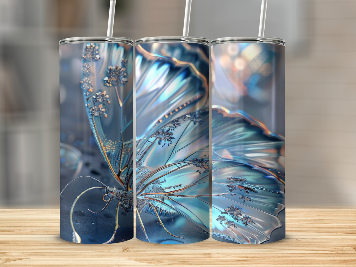 Triptych of shimmering blue butterfly tumblers with straws on a wooden surface.