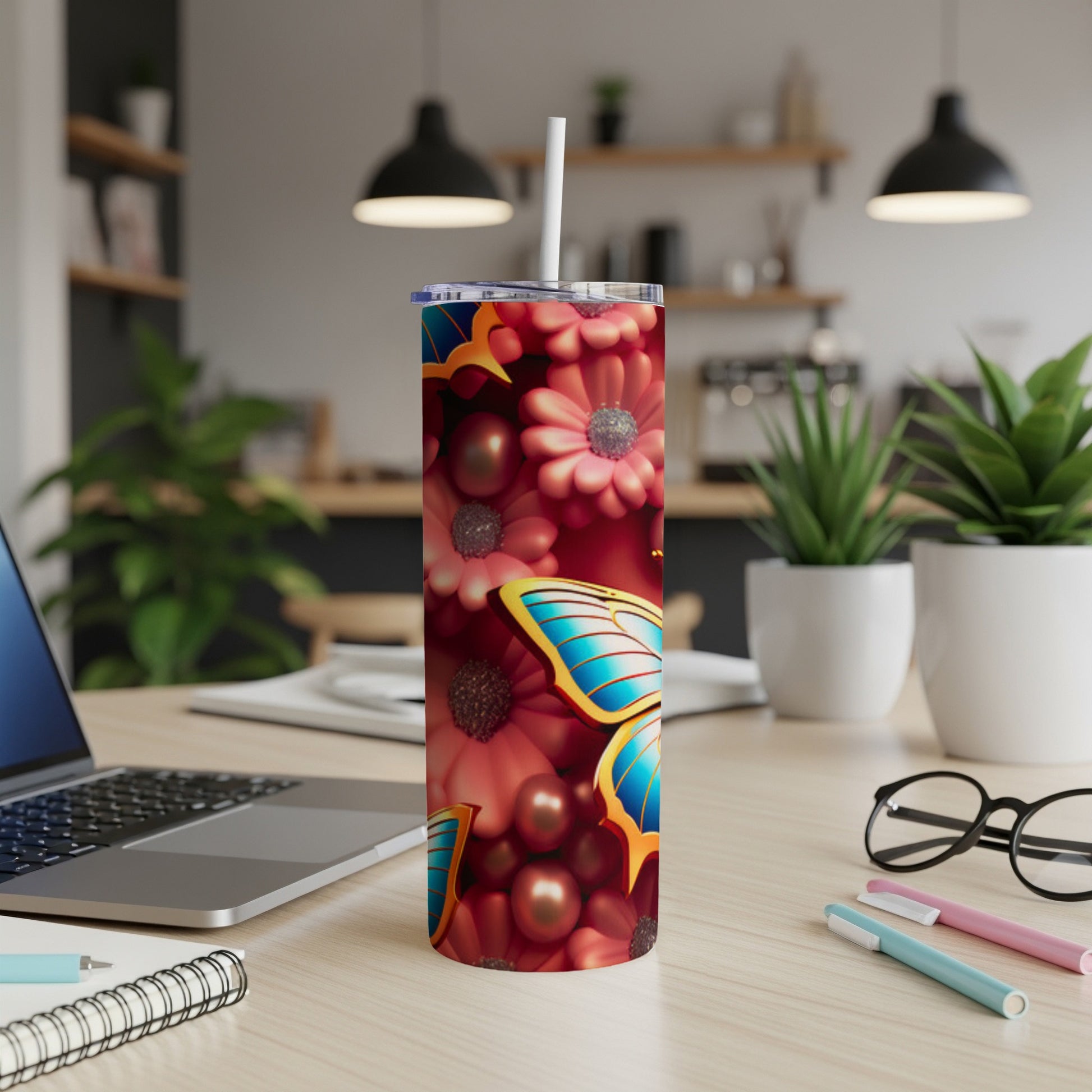 Tumbler with colorful floral pattern and large blue butterfly.