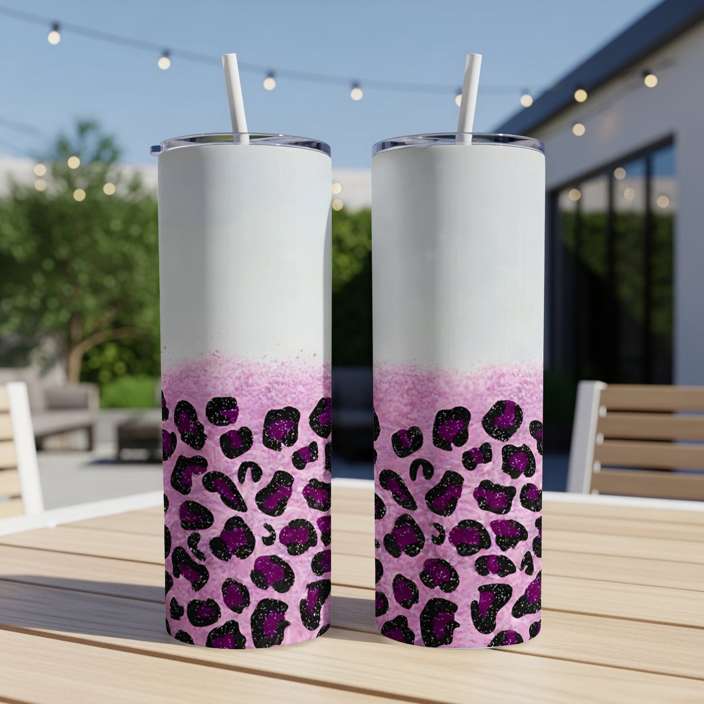 Two tall tumblers with pink leopard print and glitter accents.