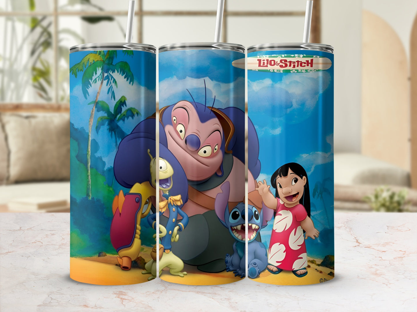 Lilo & Stitch characters on a blue, tropical patterned tumbler with a straw.