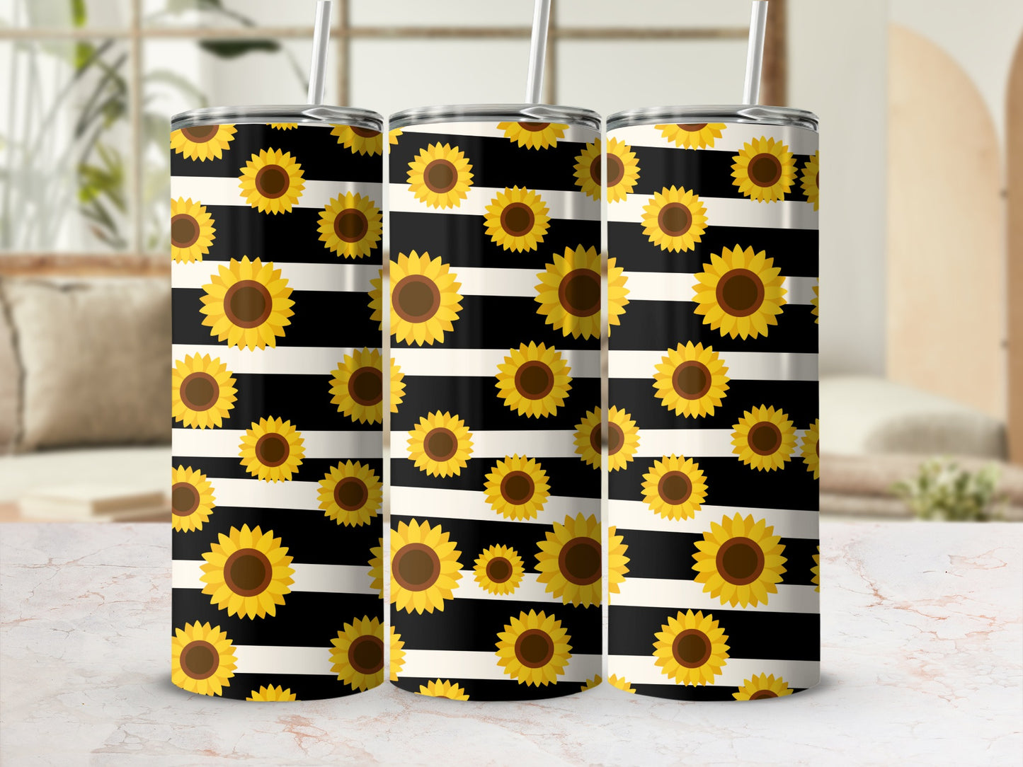 Three tumblers with black and white stripes and sunflower pattern.
