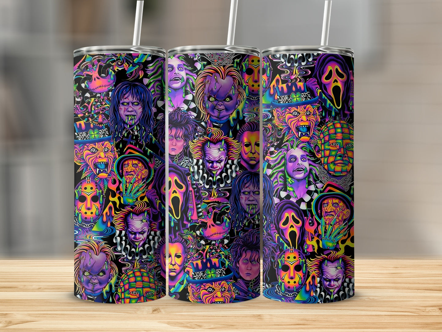 Tumblers with a collage of colorful horror movie characters and masks on a black background.