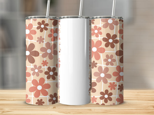 Three tall, skinny tumblers with a retro floral pattern on a wooden surface.