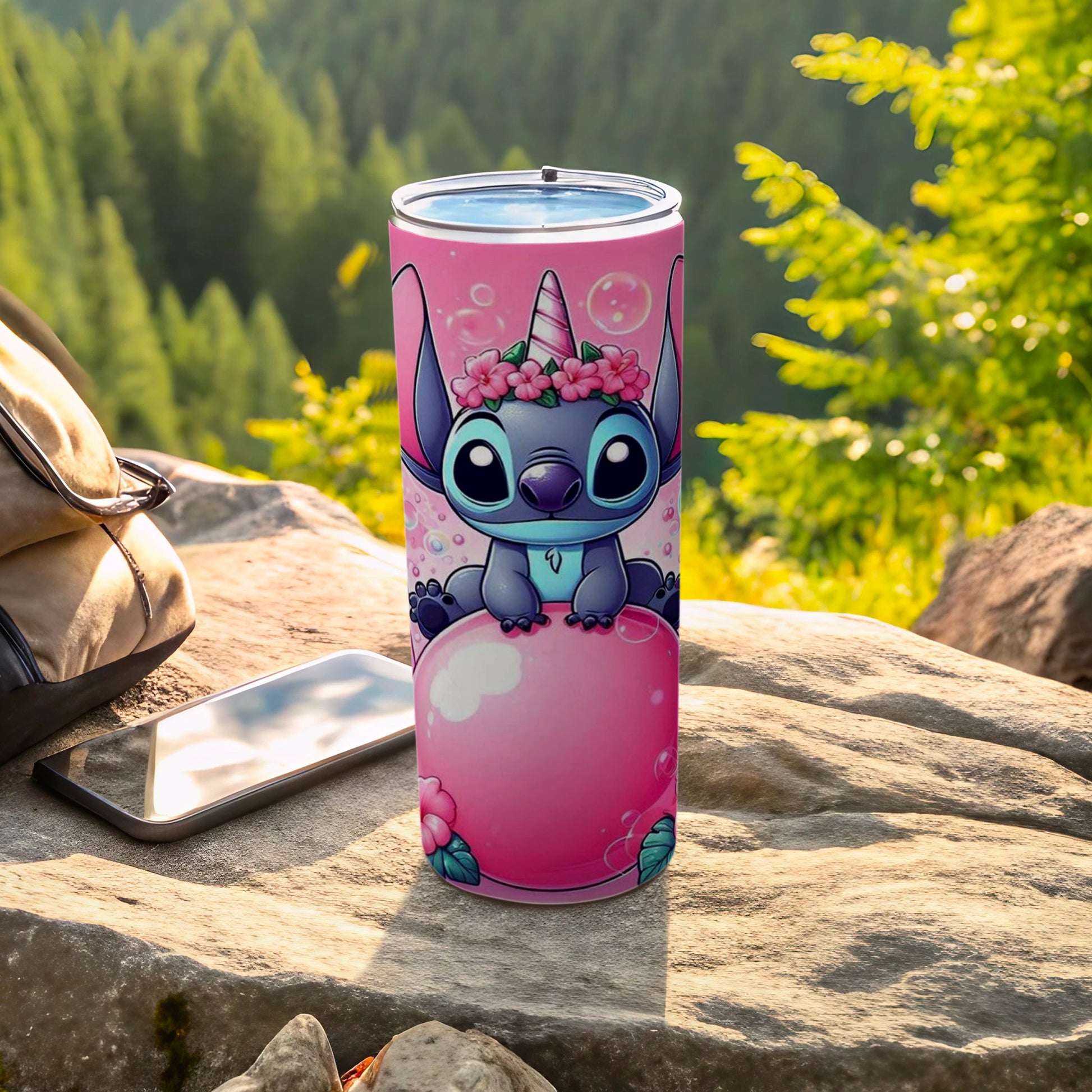 Pink tumbler with Stitch wearing a flower crown, sitting on a pink ball.