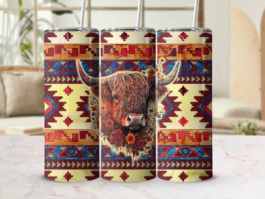 Highland cow with floral accents on a colorful Southwestern patterned tumbler.