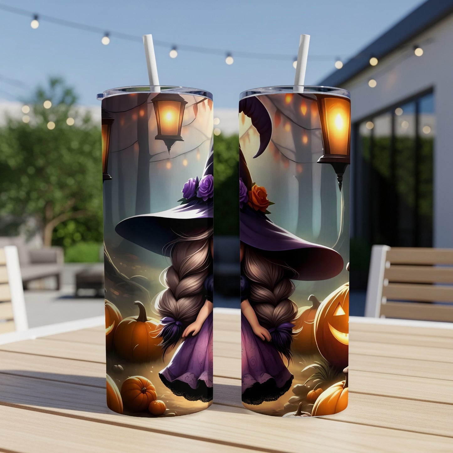 Two tumblers with Halloween witch and pumpkin design on a wooden table.