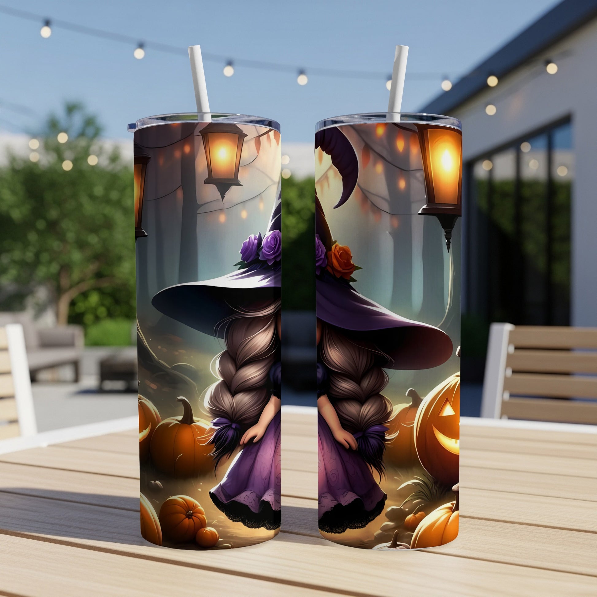 Two tumblers with Halloween witch and pumpkin design on a wooden table.