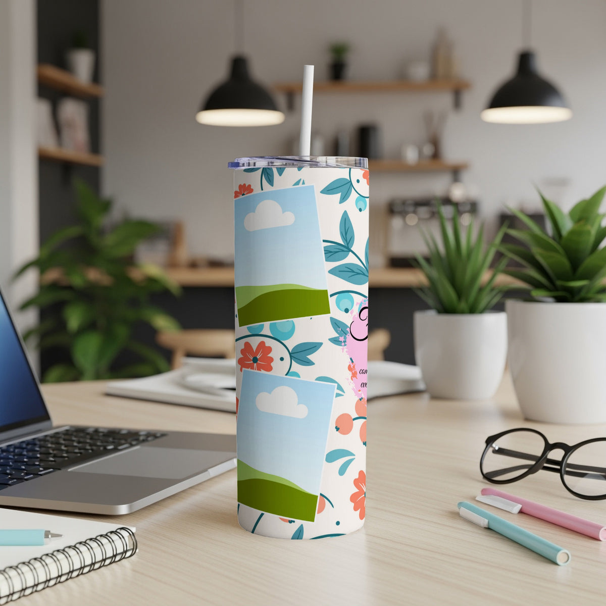 Tall tumbler with floral pattern, two photo frames, and a straw.