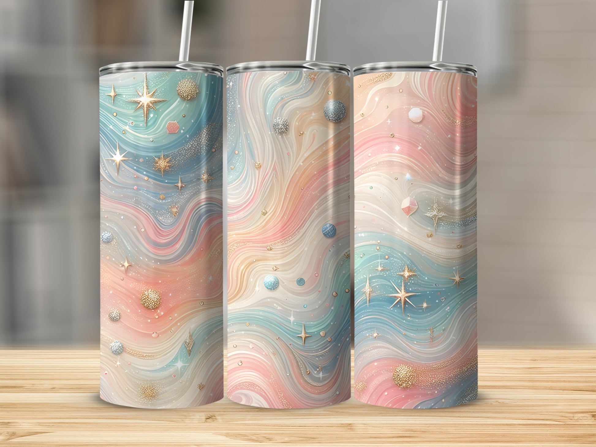 Three tumblers with swirling pastel colors, stars, and glitter accents.