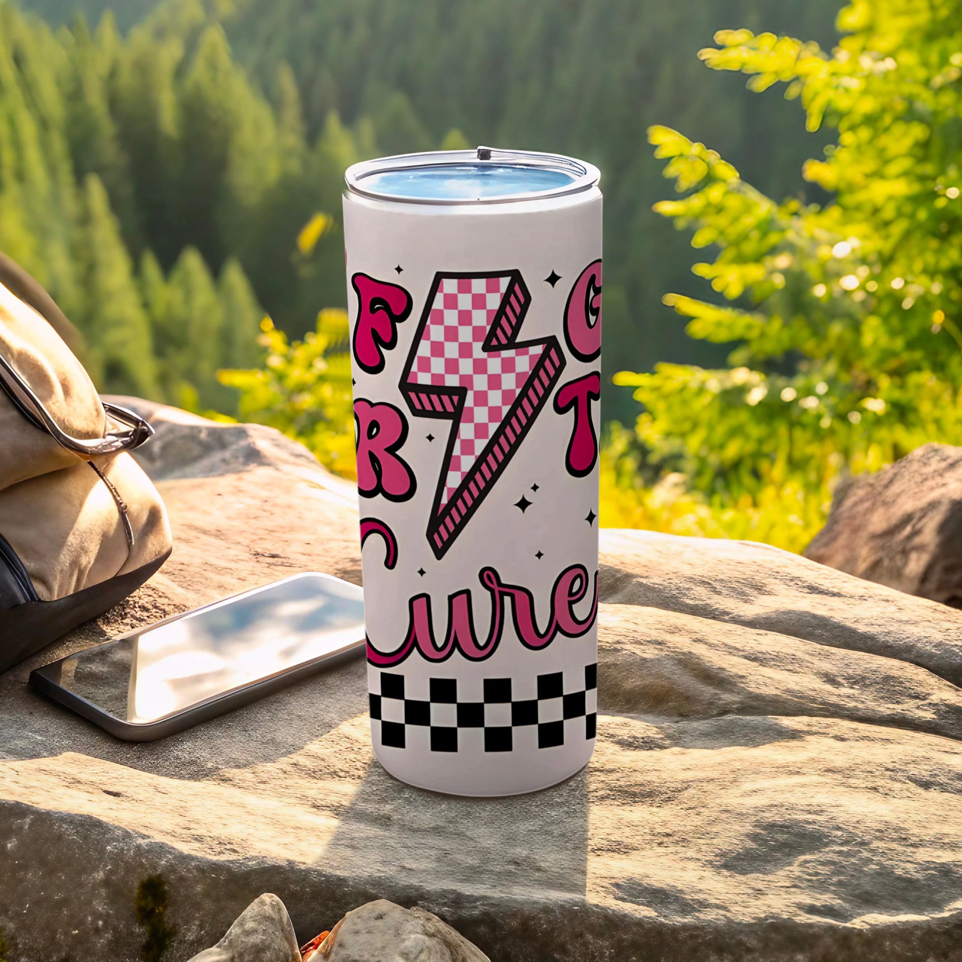 White tumbler with pink lightning bolt and checkered pattern, reading "Felt Cute".