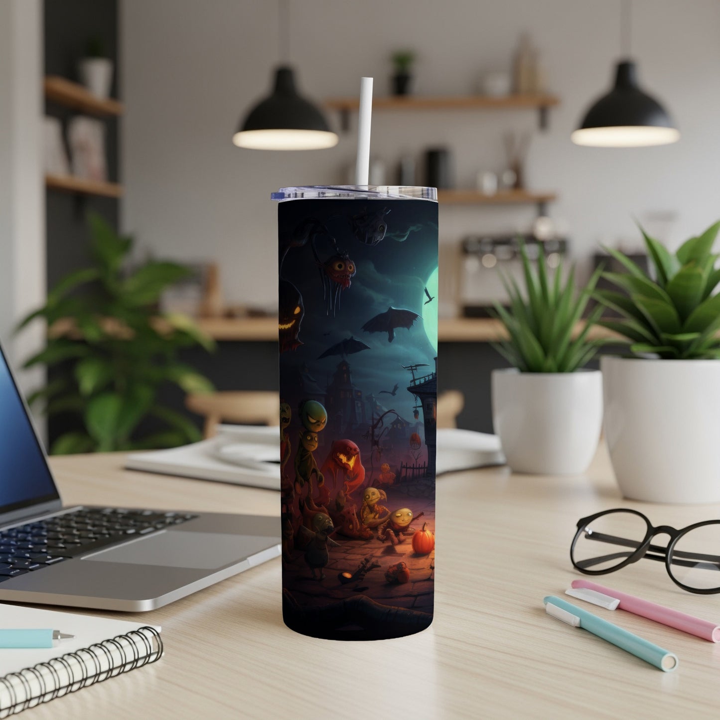 Tumbler with a spooky Halloween village scene featuring monsters, pumpkins, and bats.