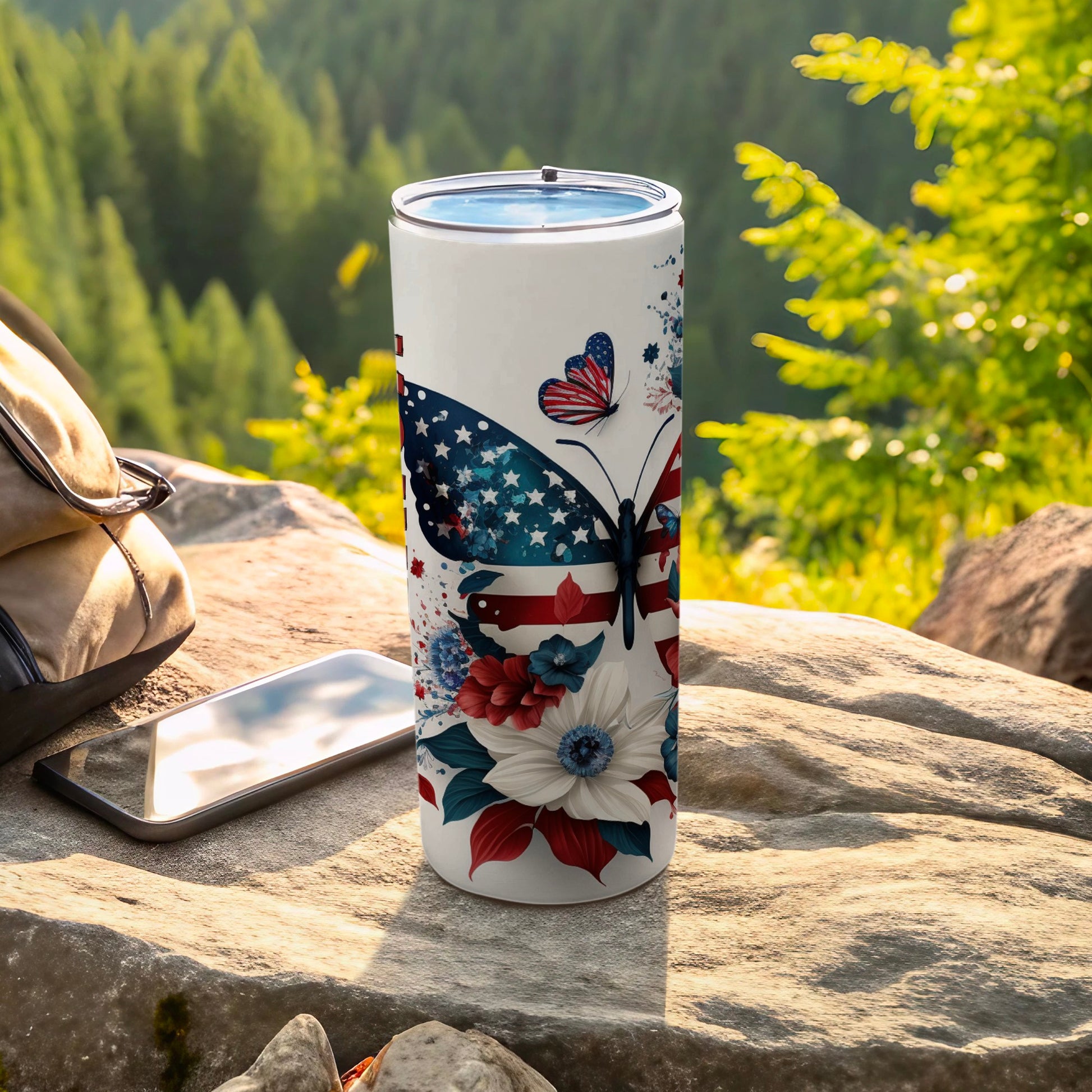 White tumbler with American flag butterfly and floral design.