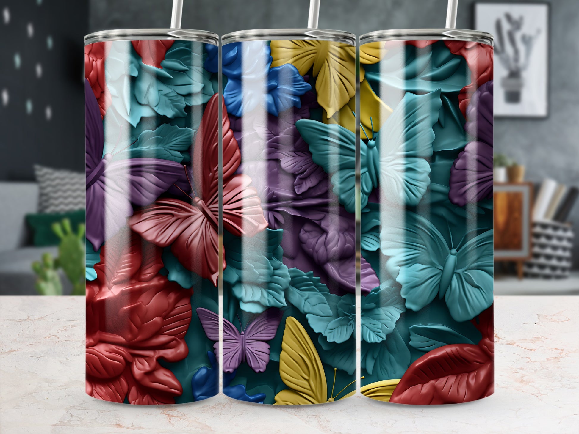 Tumbler with colorful raised butterfly and floral designs.