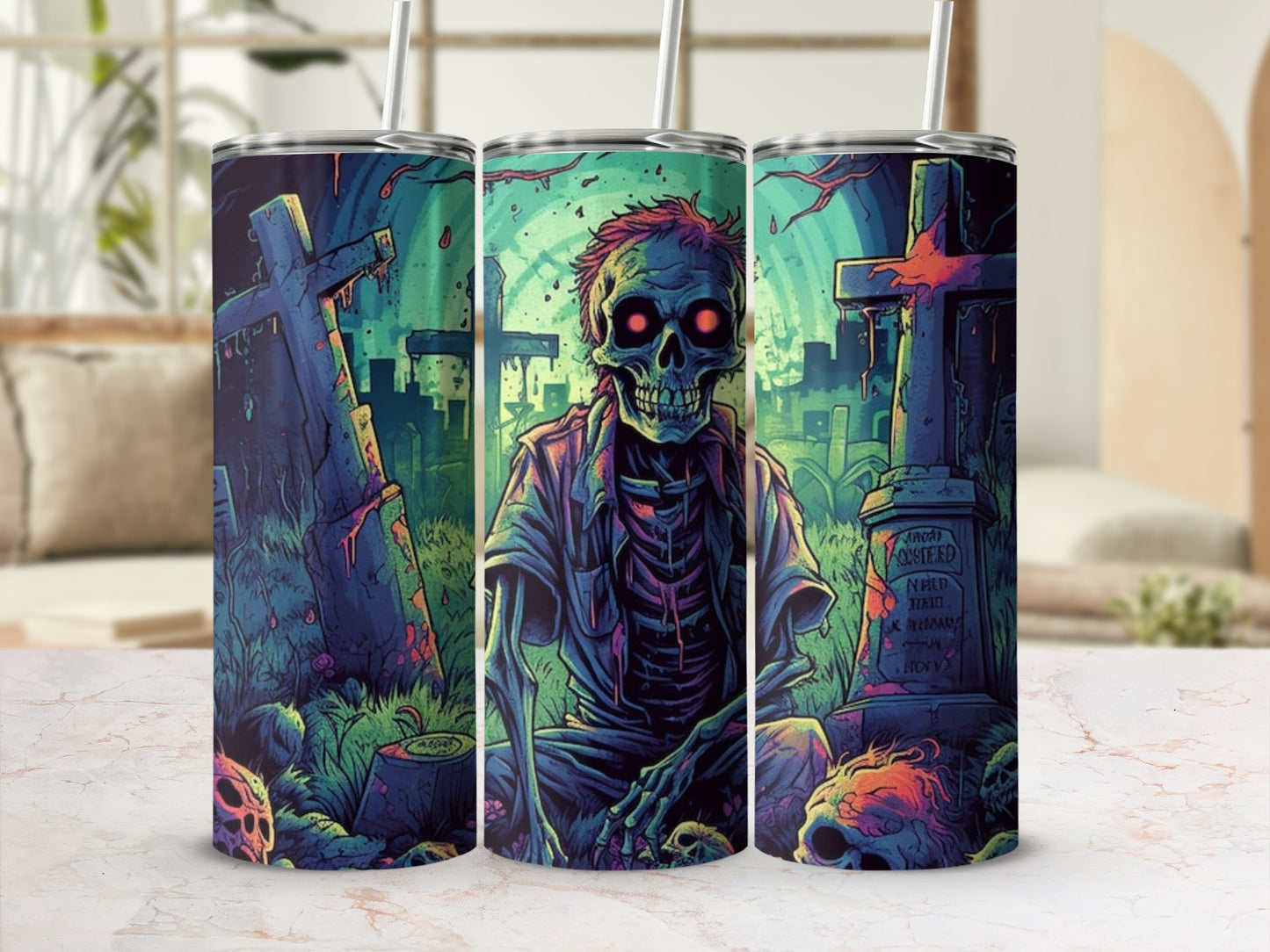 Three tumblers with a spooky graveyard scene featuring a skeleton and skulls.