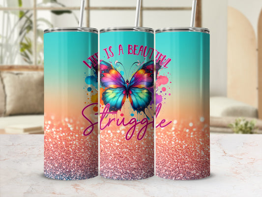 Tumbler with colorful butterfly and "Life is a beautiful struggle" text.