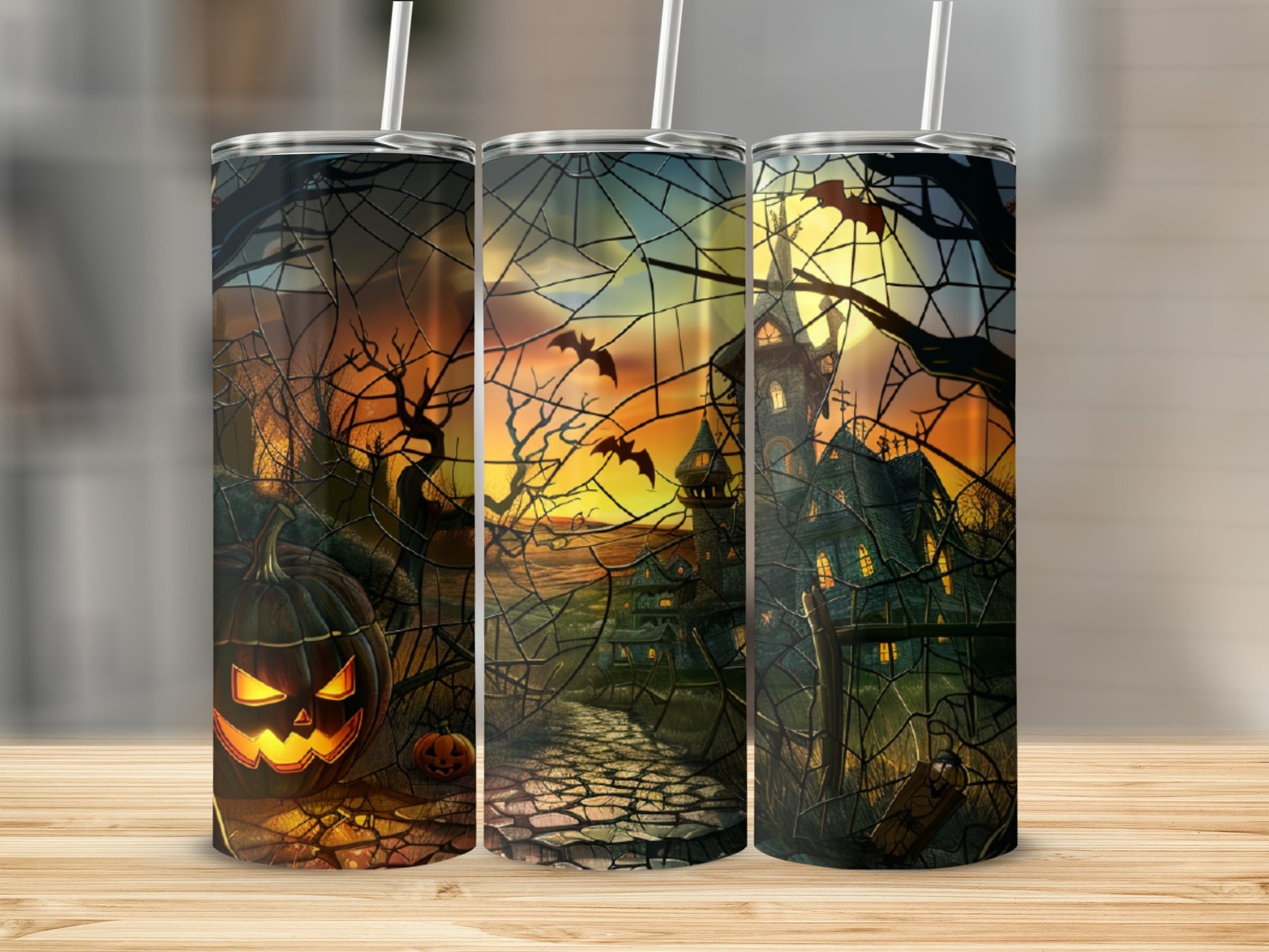Halloween tumbler with jack-o'-lantern, haunted house, bats, and spooky trees.