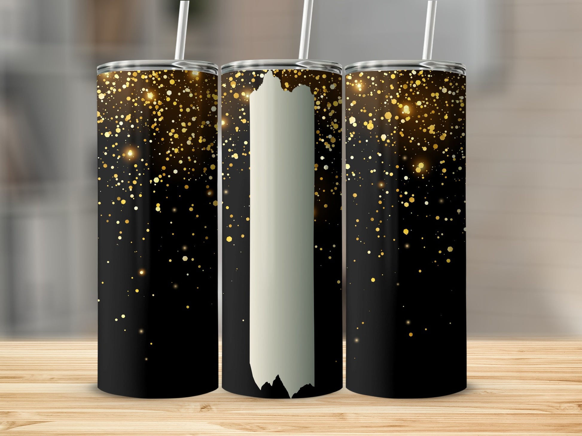 Three black tumblers with gold glitter and white accents.