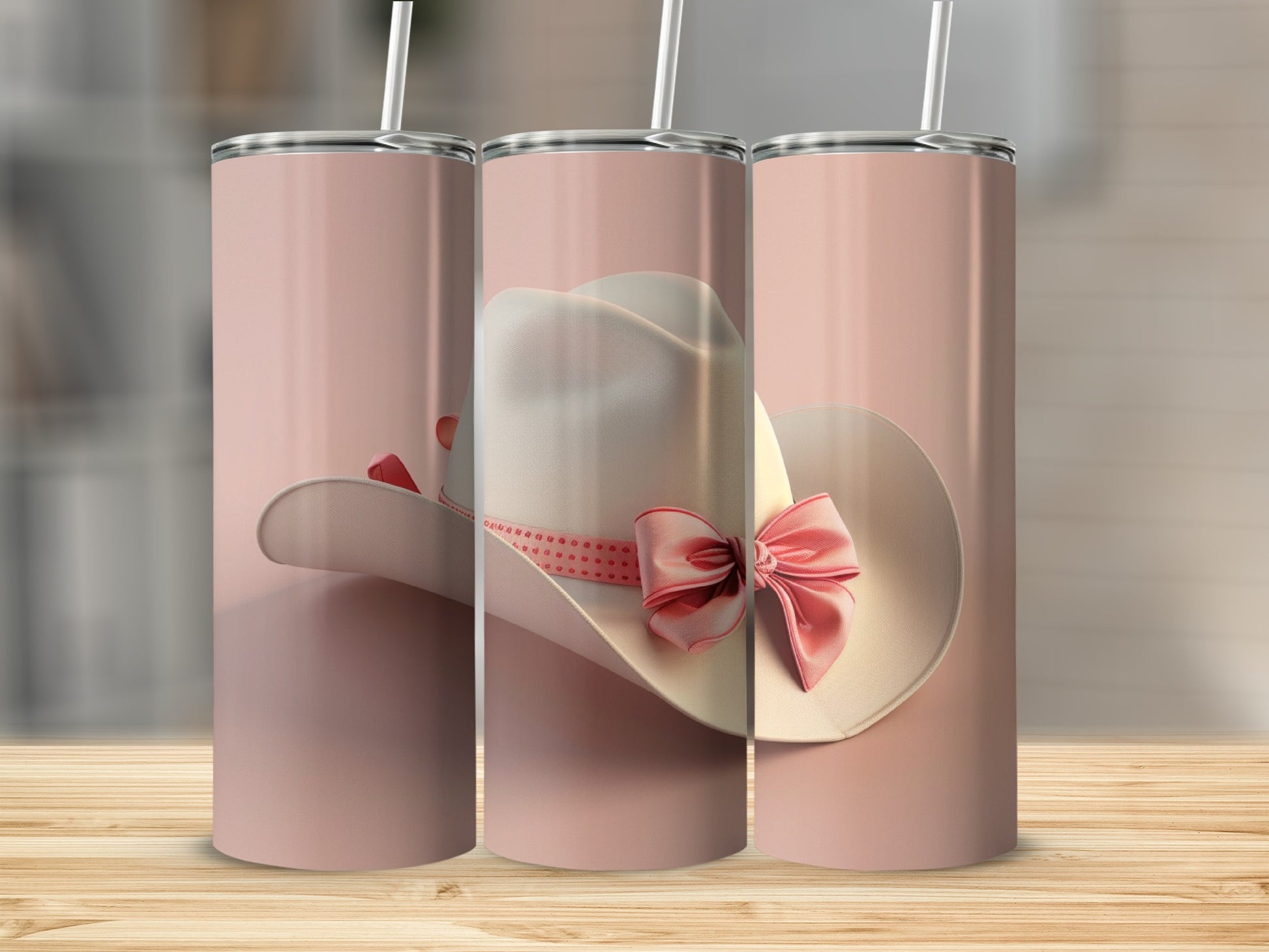 White cowboy hat with pink ribbon and bow on pink tumbler.