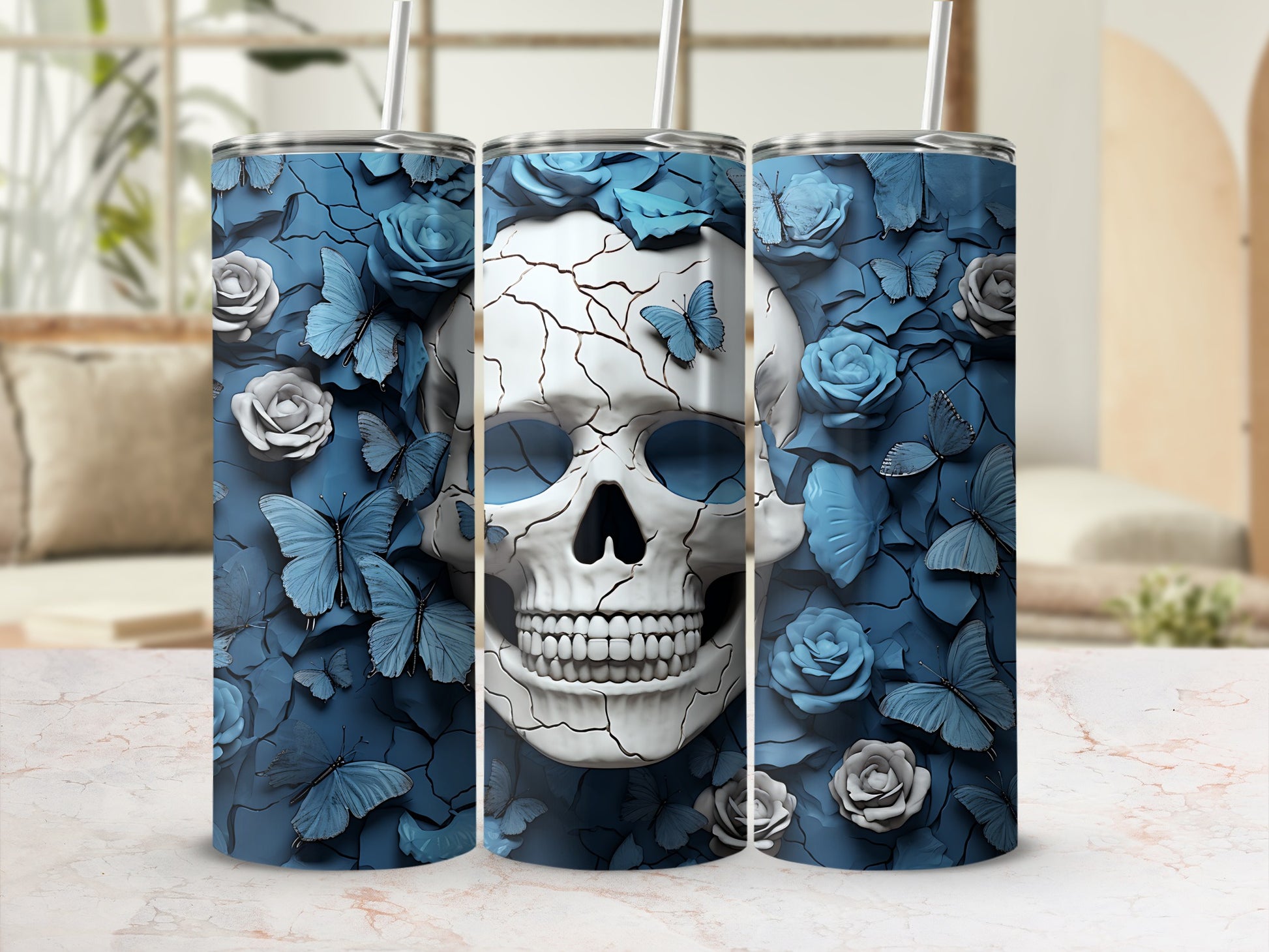 Three tumblers with a cracked skull, blue butterflies, and roses design.